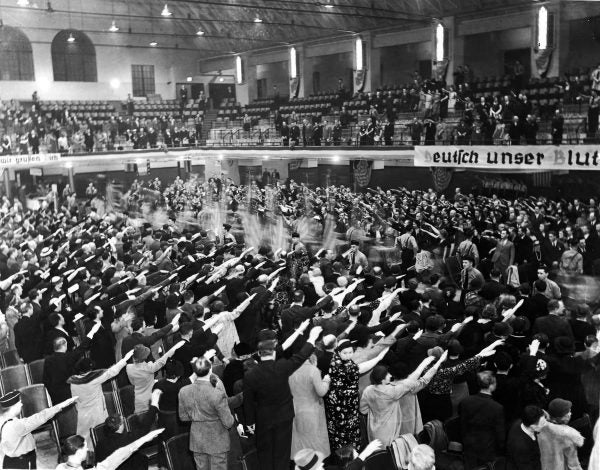 The audience at a Nazi rally in White Plans, NY on April 24, 1938, gives a Nazi salute.